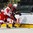 GRAND FORKS, NORTH DAKOTA - APRIL 24: Denmark's Jonas Rondbjerg #15 and Latvia's Tomass Zeile #5 battle for the puck during relegation round action at the 2016 IIHF Ice Hockey U18 World Championship. (Photo by Matt Zambonin/HHOF-IIHF Images)

